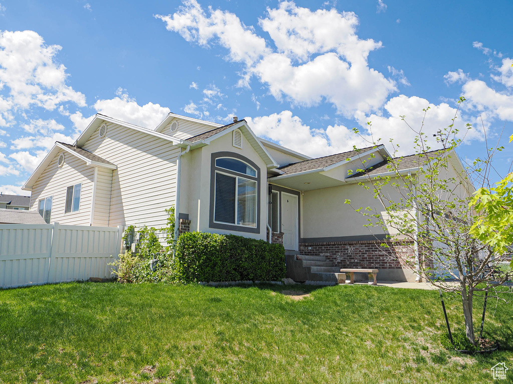 Single story home with brick siding and stucco siding
