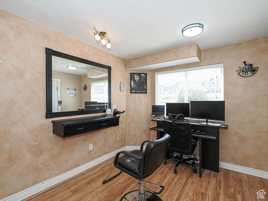 Office area with wood finished floors and baseboards