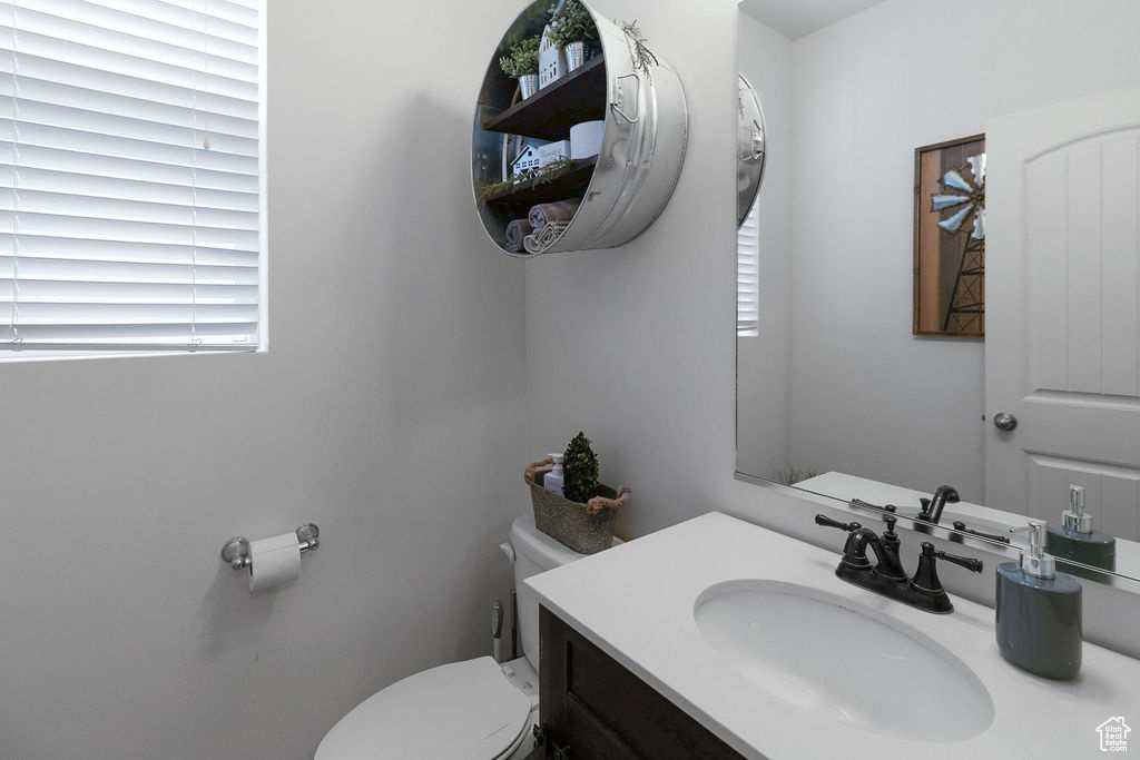 Bathroom with toilet and vanity