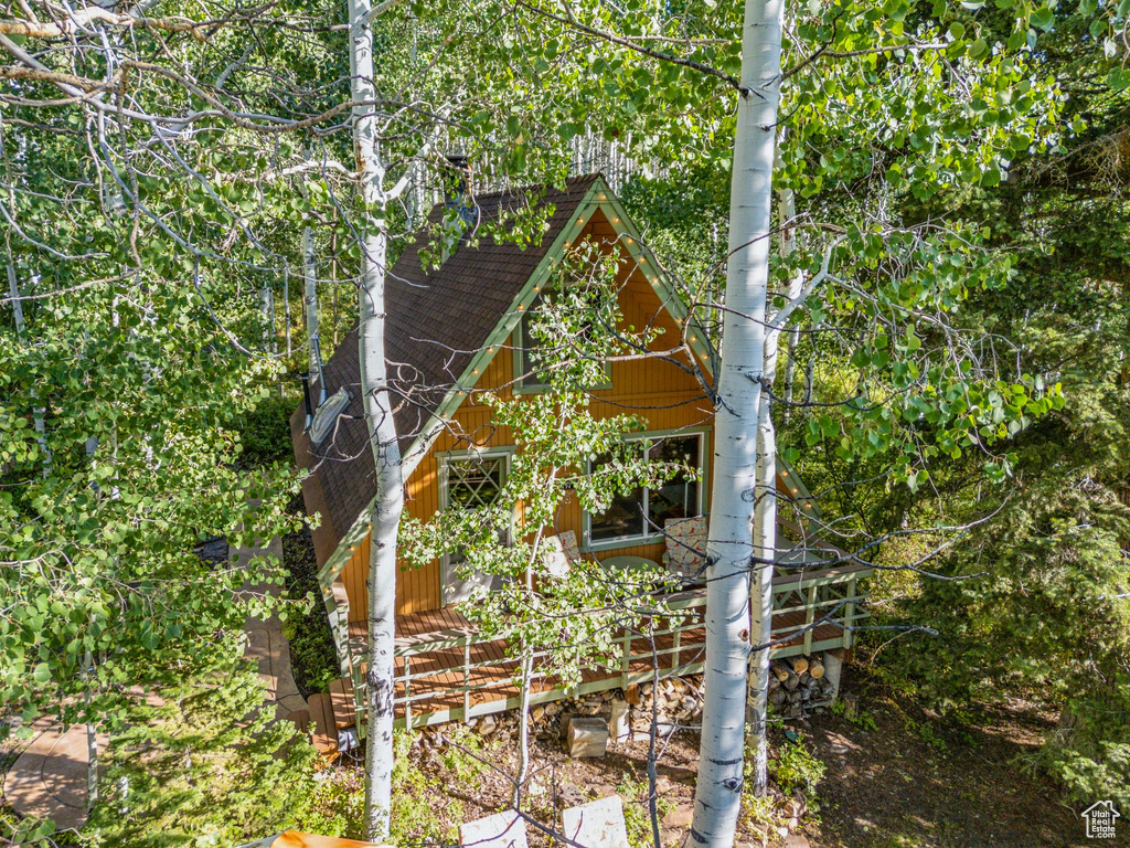 View of home\'s exterior with a shingled roof