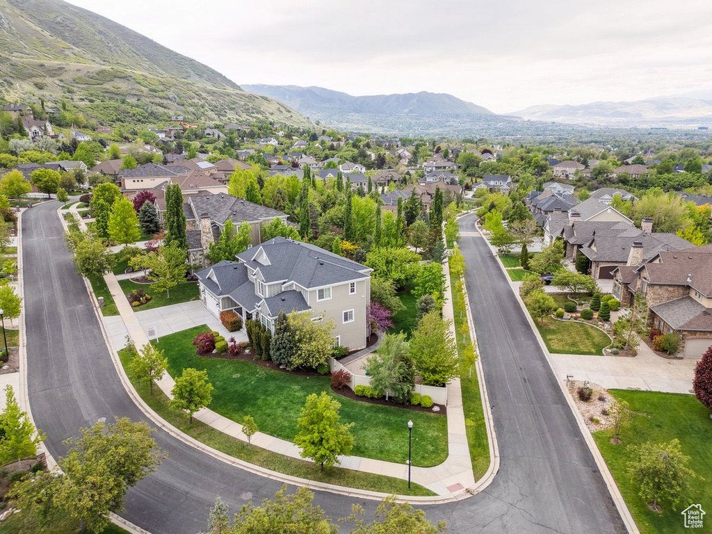 Aerial perspective of suburban area with a mountainous background