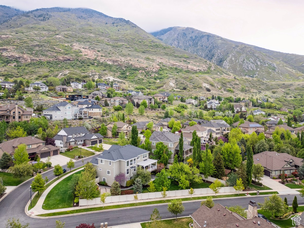 Aerial view of residential area featuring a mountainous background