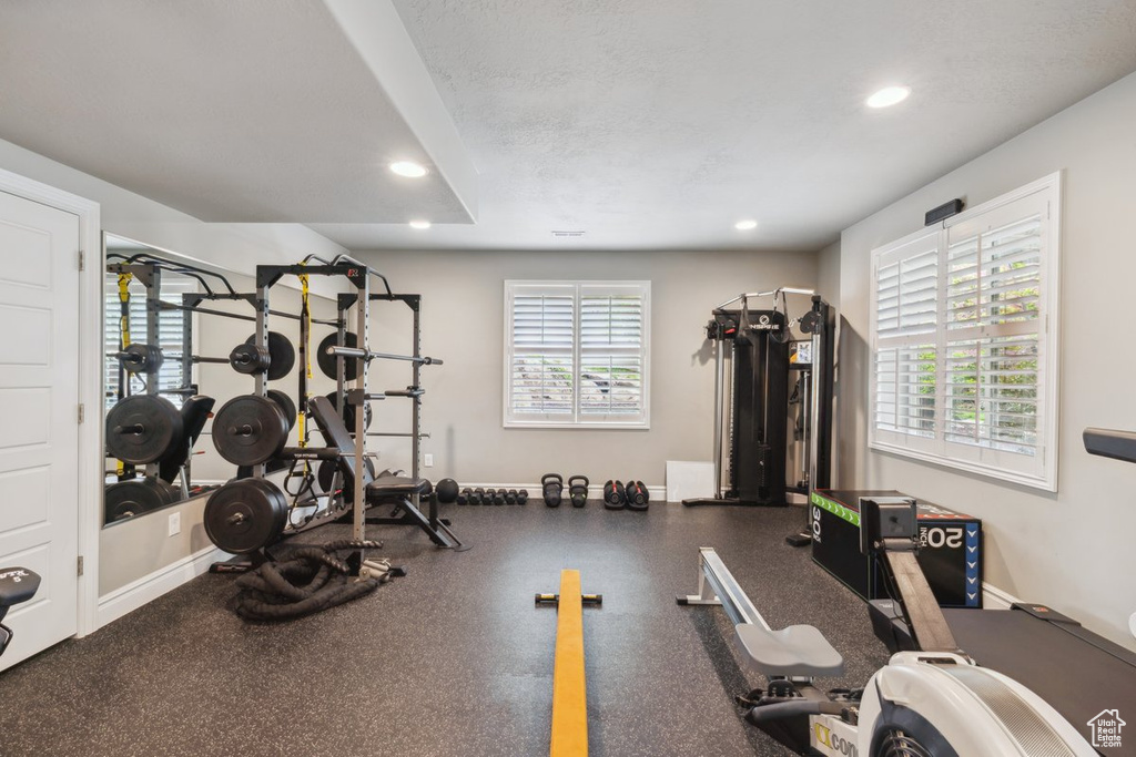 Exercise area featuring recessed lighting and baseboards