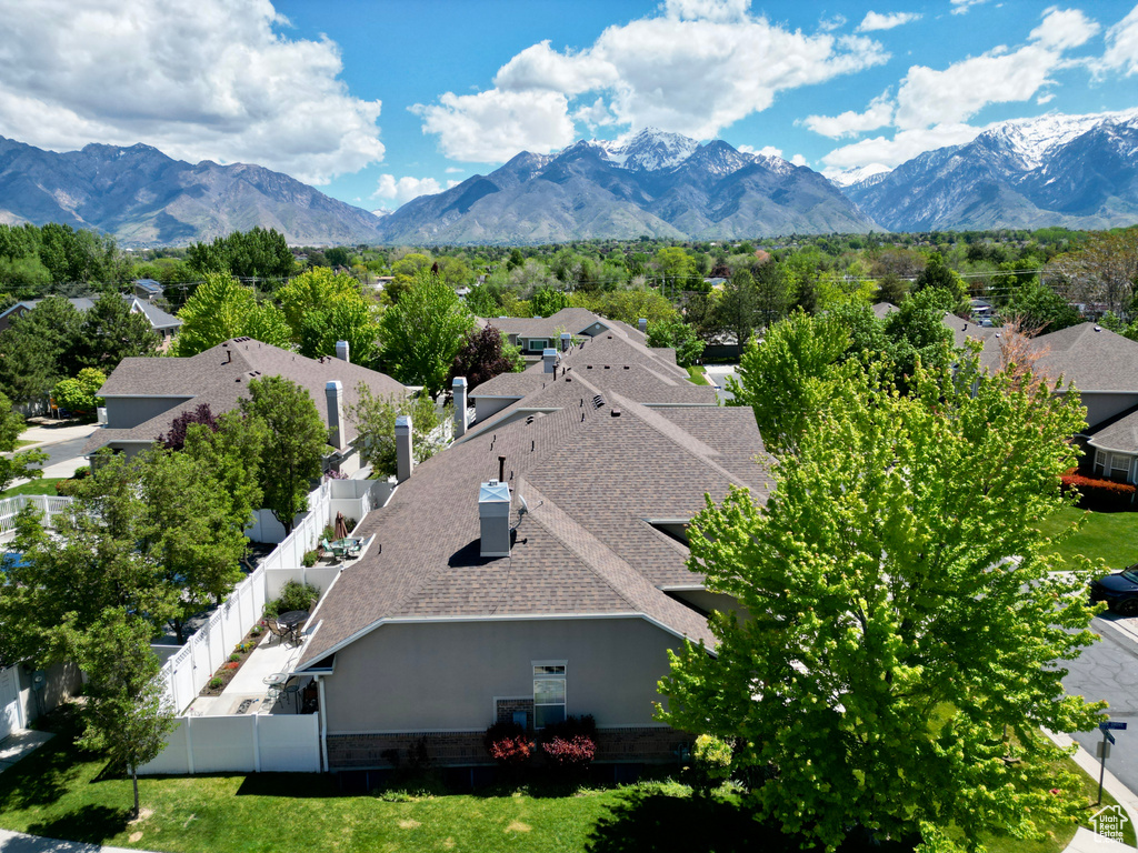 Aerial perspective of suburban area featuring a mountainous background
