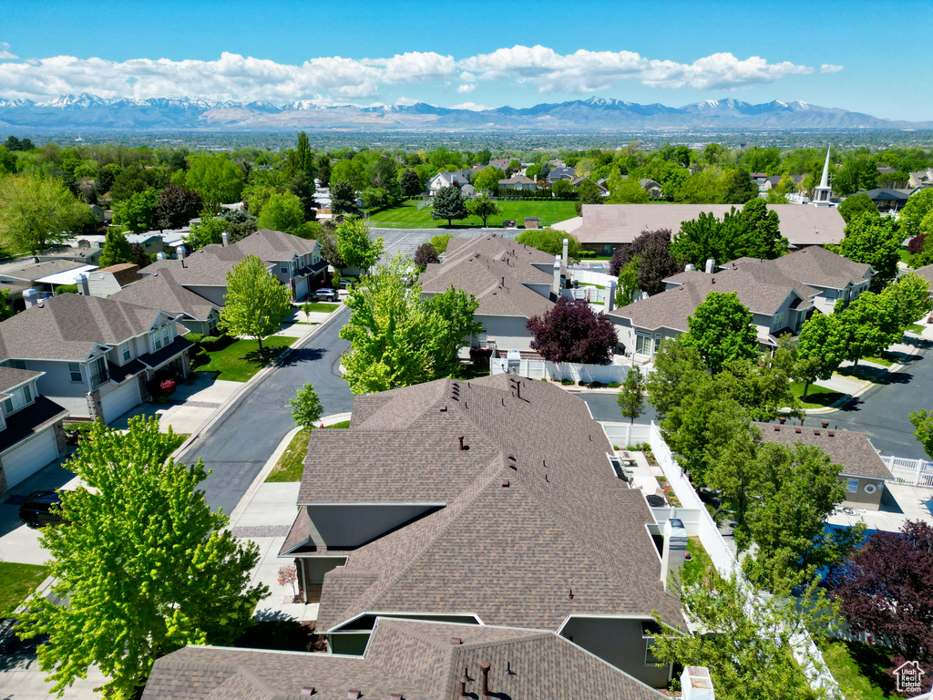 Aerial perspective of suburban area featuring a mountainous background