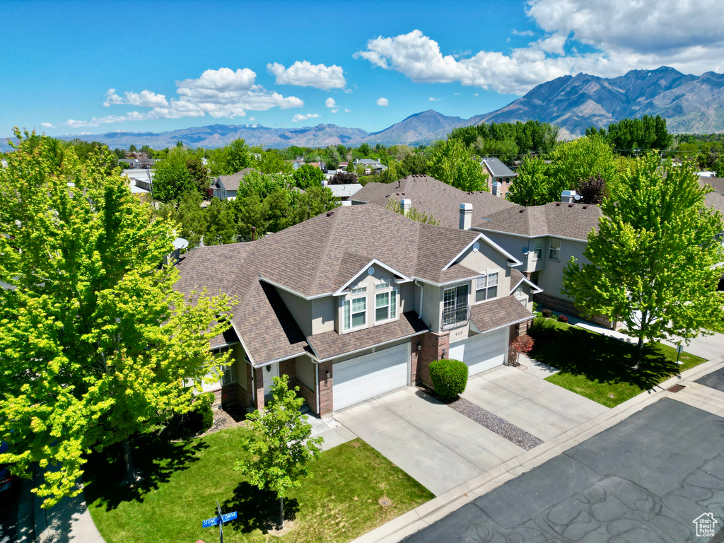 View of subject property with a mountain backdrop