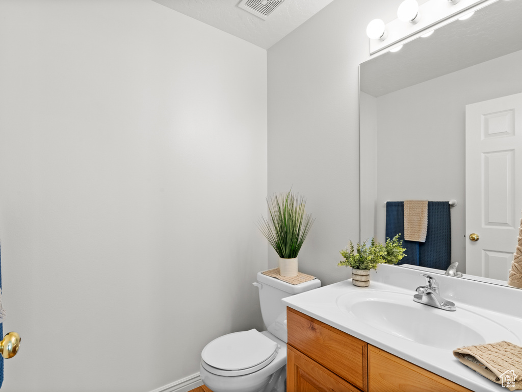 Bathroom with toilet and vanity