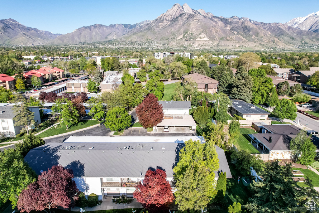 Aerial view of residential area featuring a mountainous background