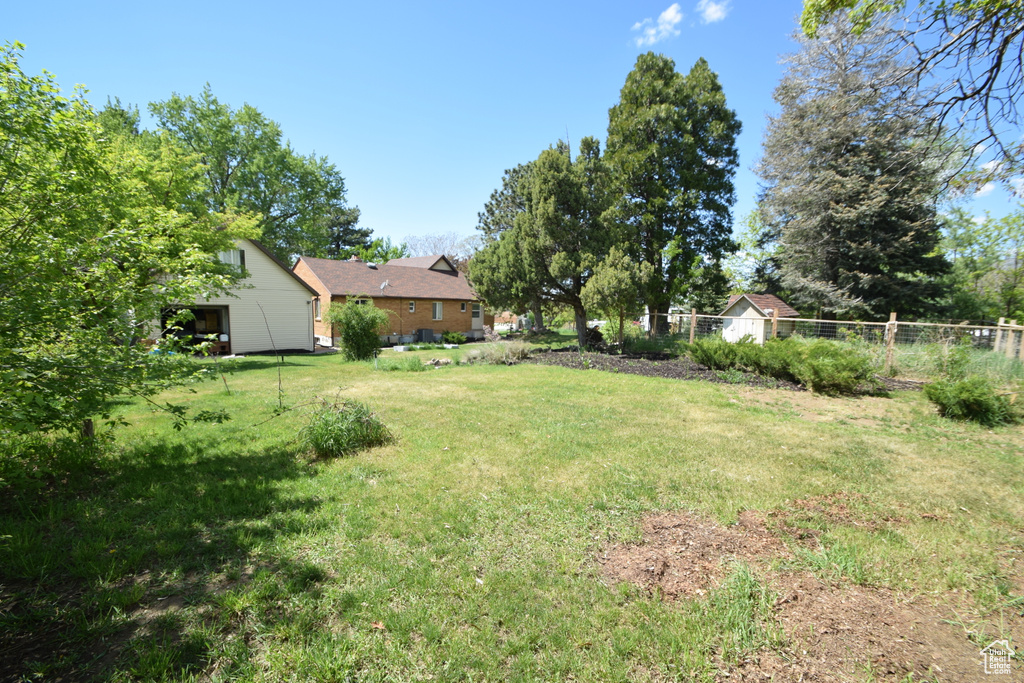 View of yard with a detached garage