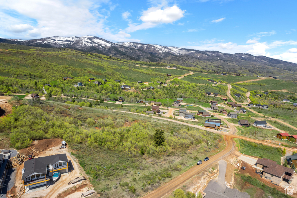 Aerial view of property and surrounding area with mountains