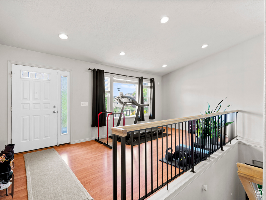 Foyer featuring wood finished floors, recessed lighting, and baseboards