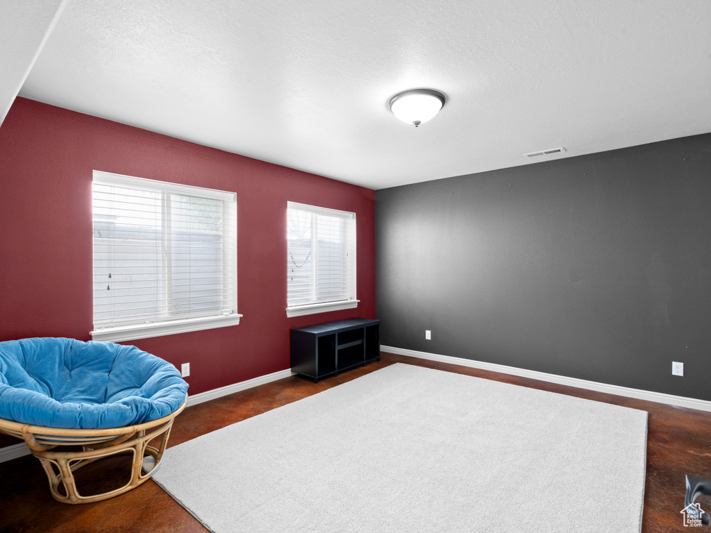 Sitting room featuring baseboards