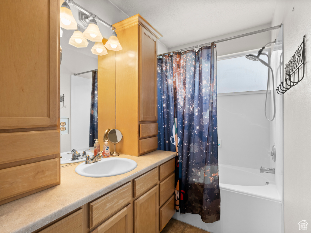 Full bathroom with vanity and shower / tub combo