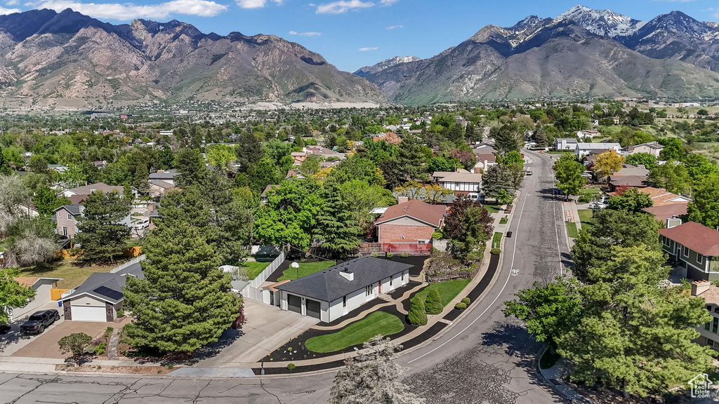 Aerial perspective of suburban area with a mountain backdrop