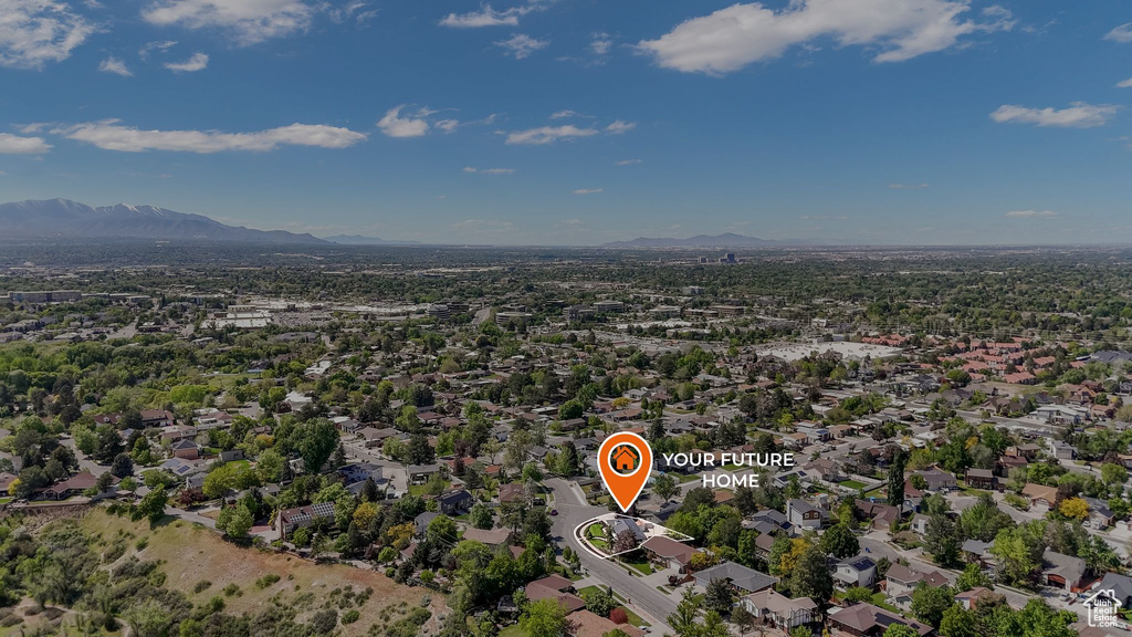 View of property location with mountains and nearby suburban area