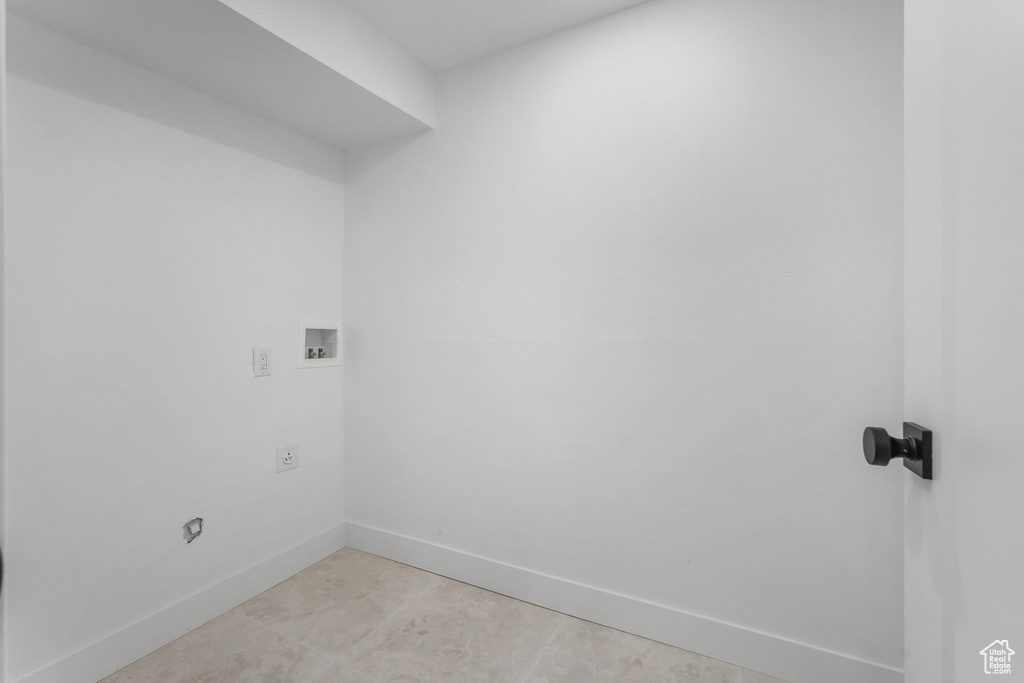 Laundry room with baseboards, hookup for an electric dryer, and washer hookup