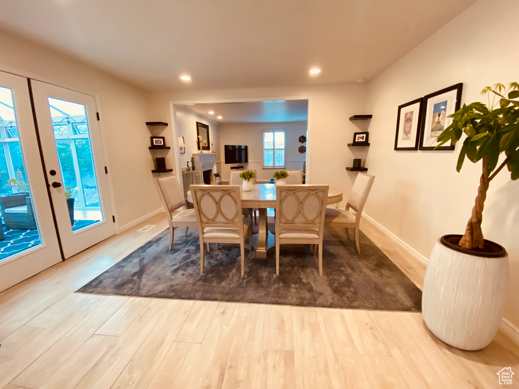 Dining area featuring wood finished floors, recessed lighting, and baseboards