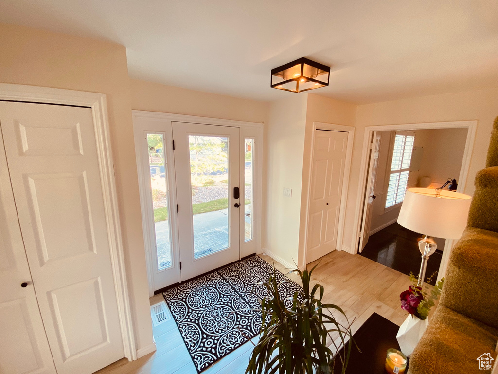 Entryway featuring light wood-style floors and baseboards