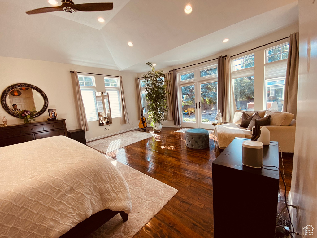 Bedroom featuring access to exterior, dark wood-style floors, lofted ceiling, recessed lighting, and baseboards