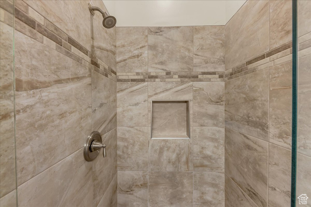 Bathroom view of a tile shower