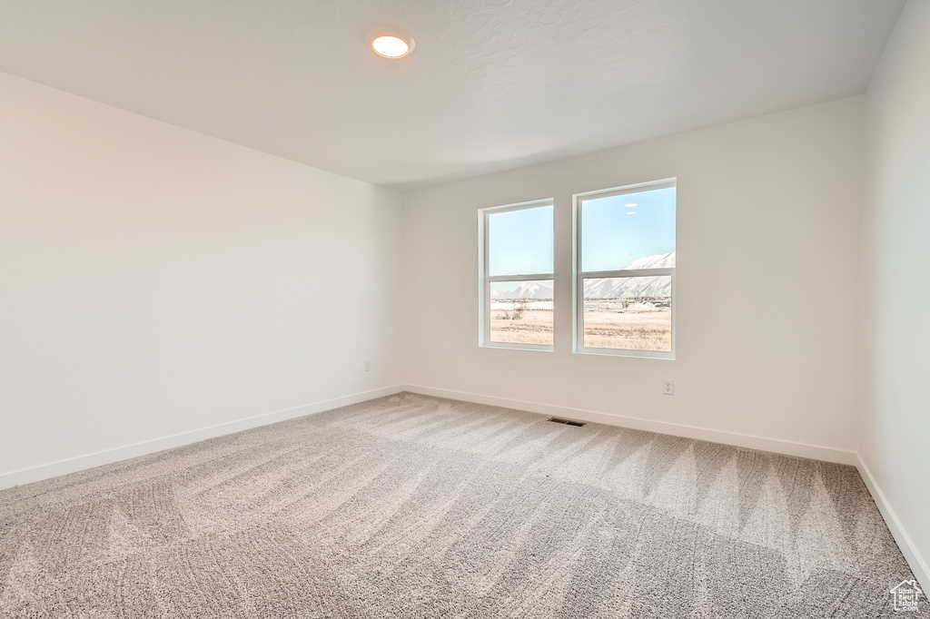 Spare room with carpet flooring and baseboards
