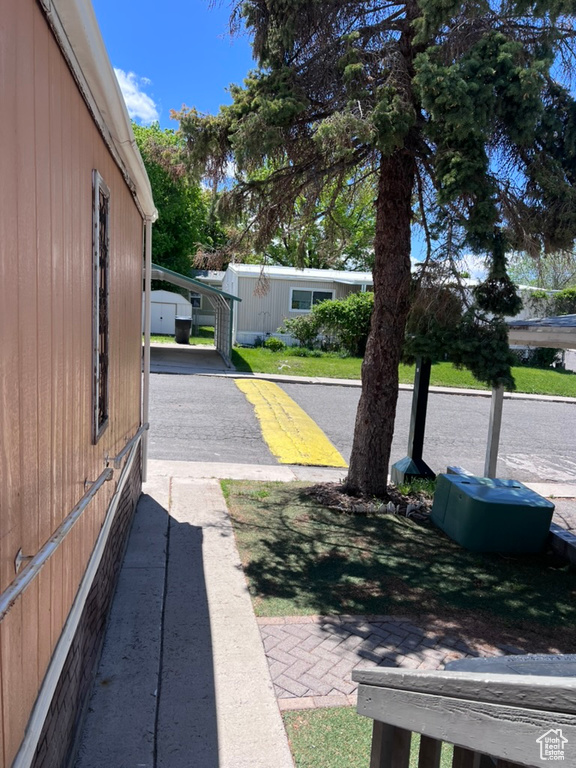 View of yard with a carport