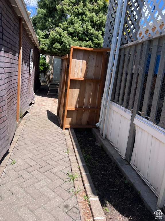 View of patio with fence