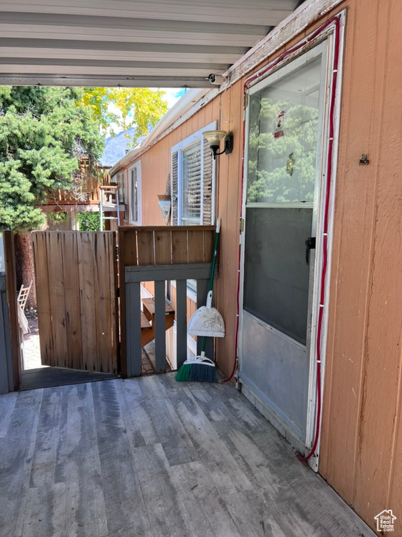 Wooden deck featuring a gate and fence