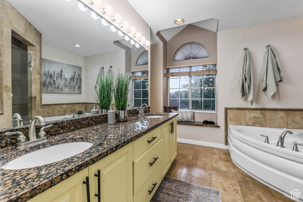 Bathroom with a bath and double vanity