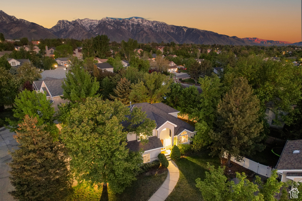 View of property location featuring mountains and nearby suburban area