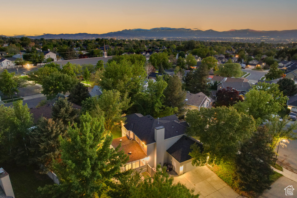 Aerial view at dusk of a mountain view and a residential view