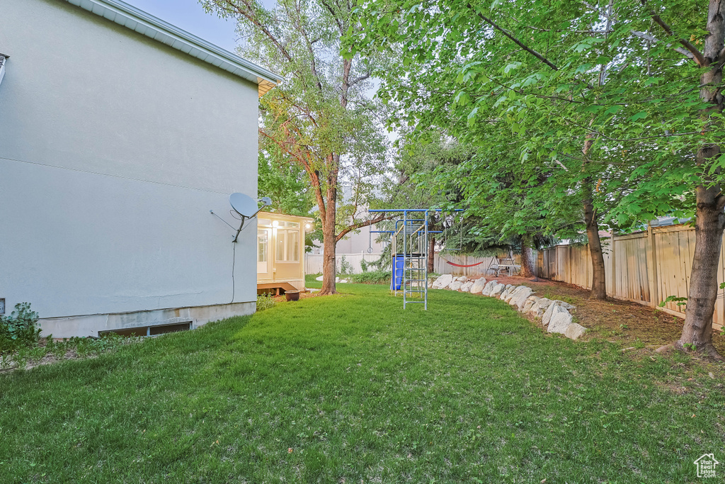 View of yard with a playground