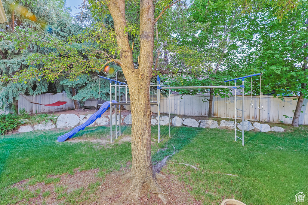 View of yard featuring a playground