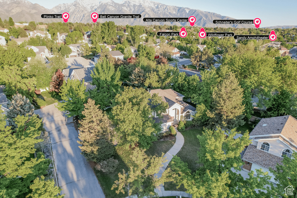 View of property location with a mountain backdrop and nearby suburban area