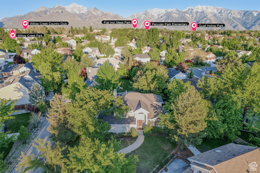 View of property location with mountains and nearby suburban area