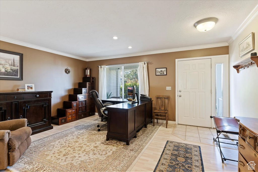 Office area featuring crown molding and light wood-style floors