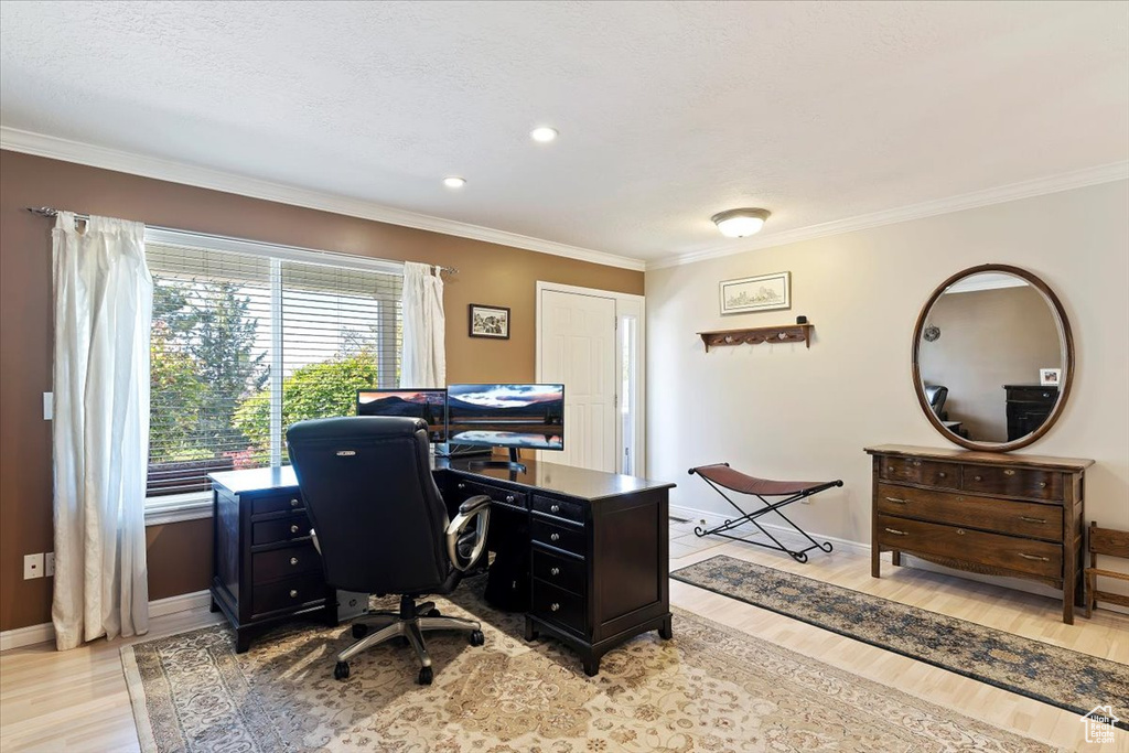 Office area featuring light wood-style flooring, ornamental molding, baseboards, and recessed lighting