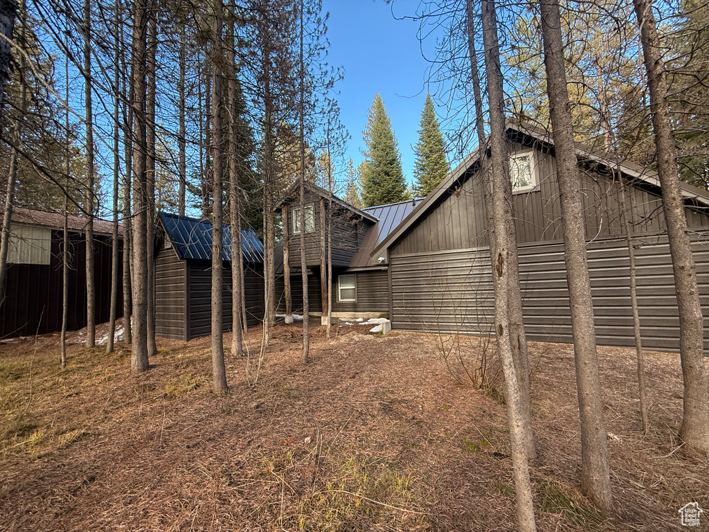 View of home's exterior with metal roof