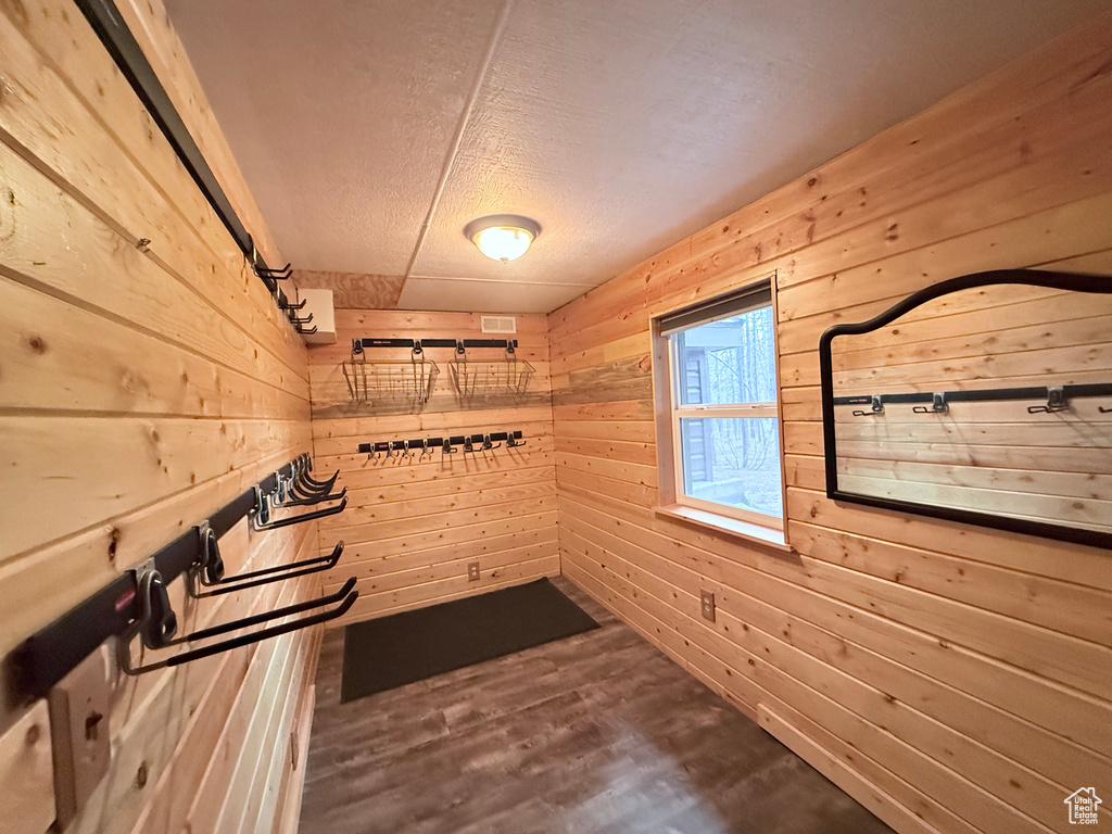 Interior space with wooden walls and wood finished floors