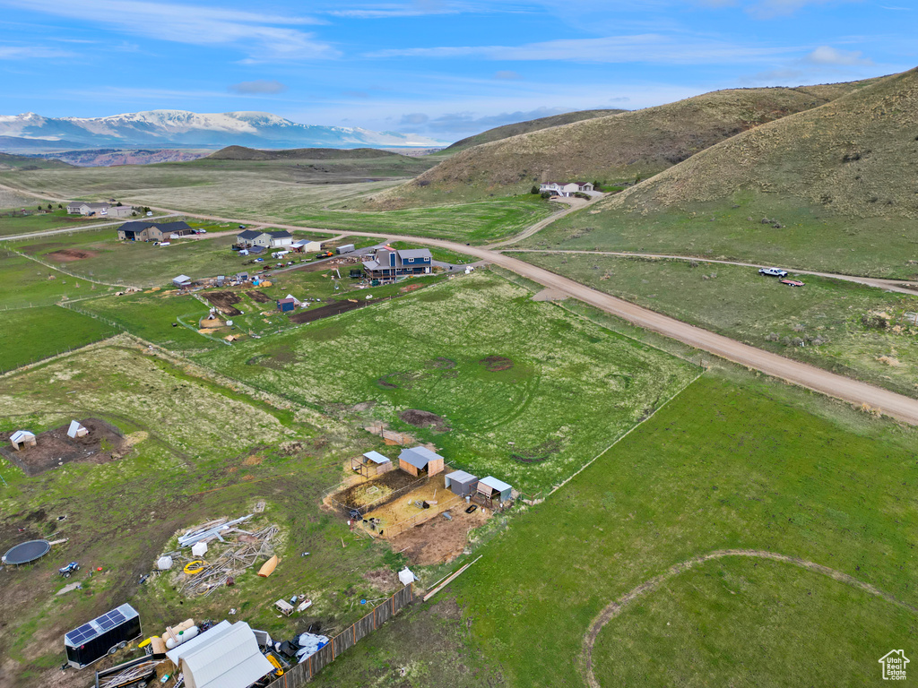 Aerial view of property's location with a mountain backdrop