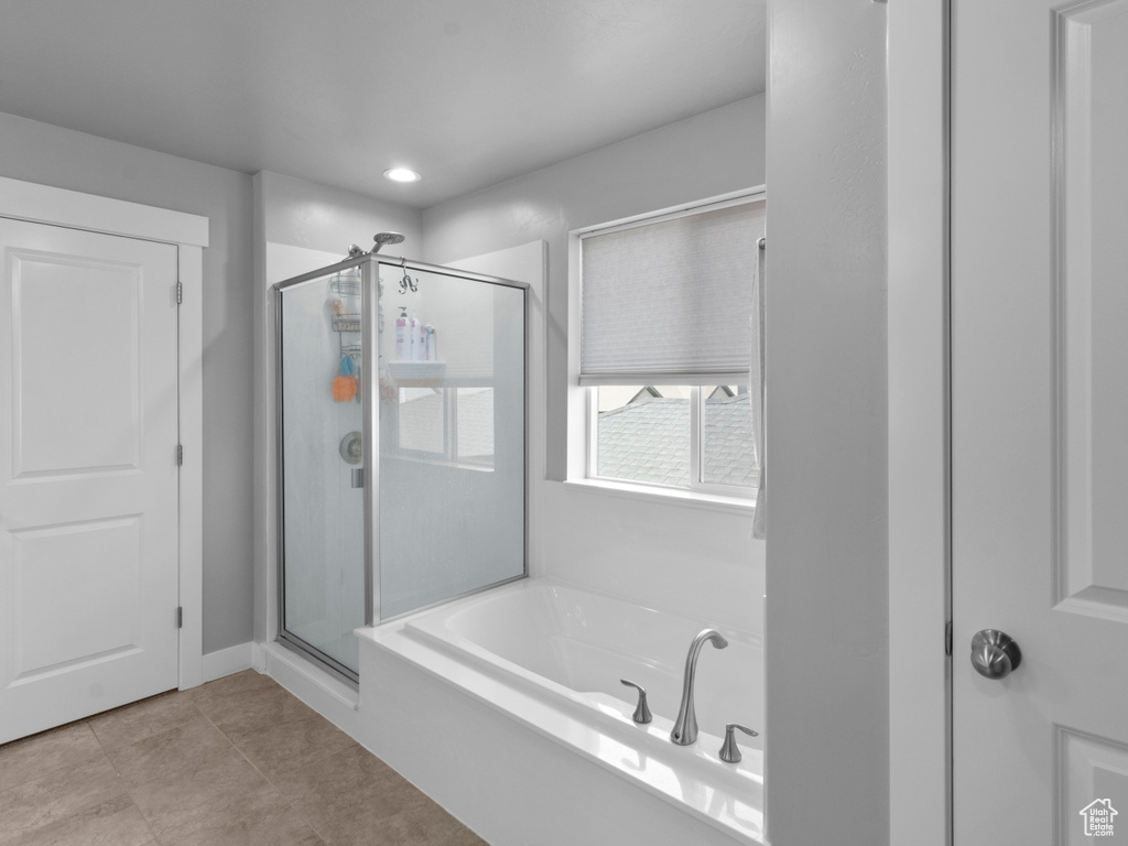 Full bath featuring a shower stall, a garden tub, tile patterned flooring, and recessed lighting