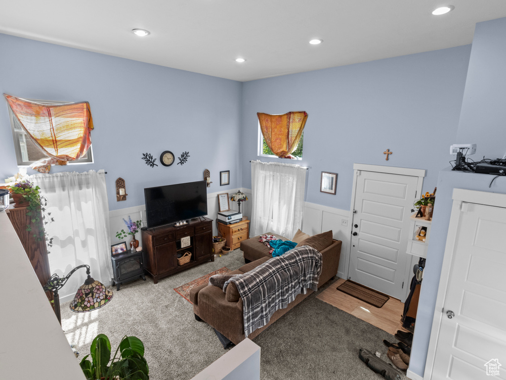 Carpeted living area featuring recessed lighting