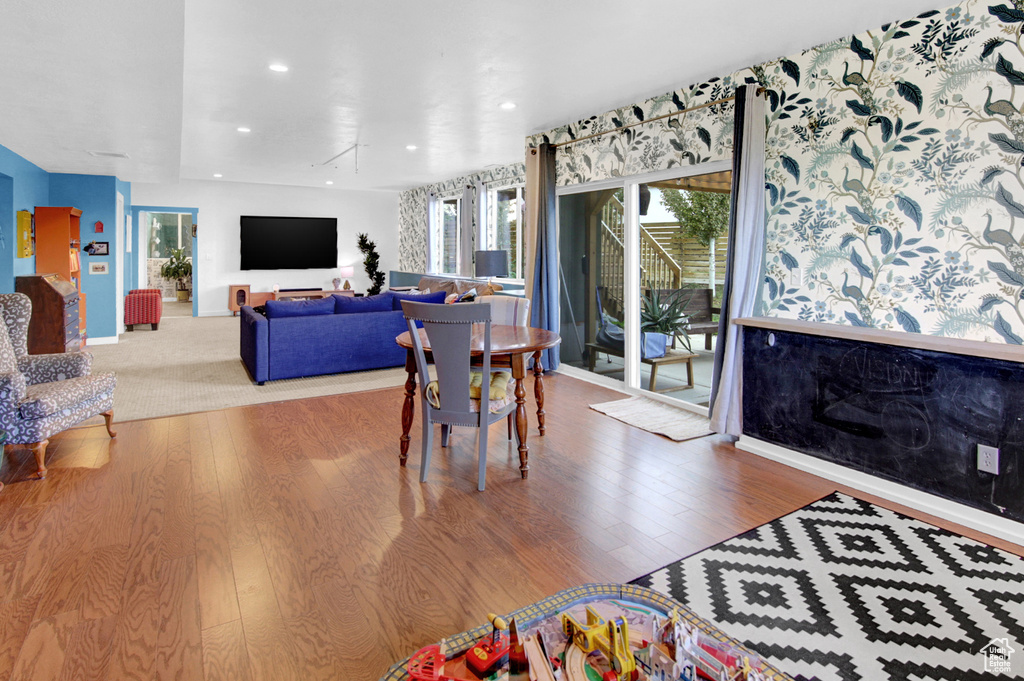 Dining space featuring wood finished floors and recessed lighting