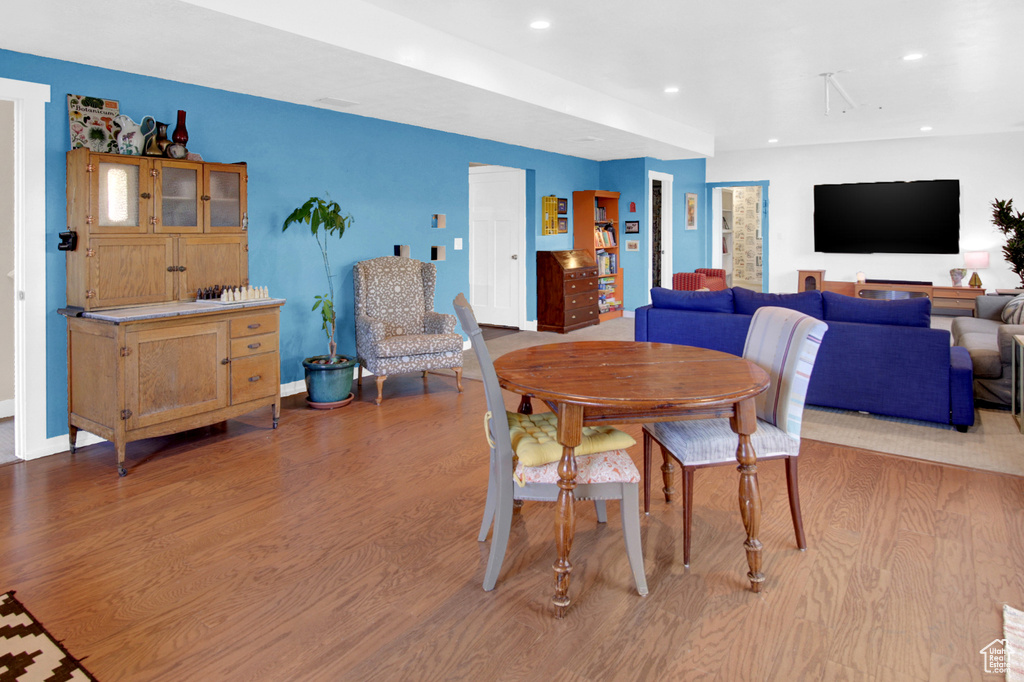 Dining space featuring wood finished floors, recessed lighting, and baseboards