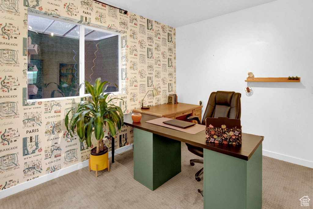 Carpeted office featuring baseboards