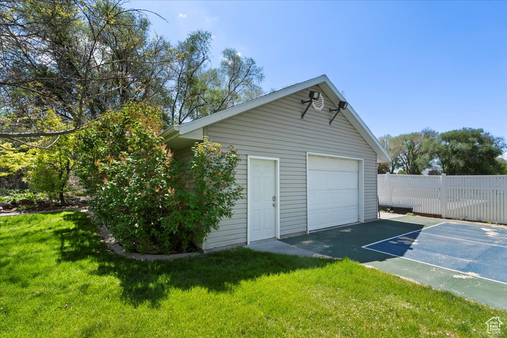 Detached garage featuring driveway