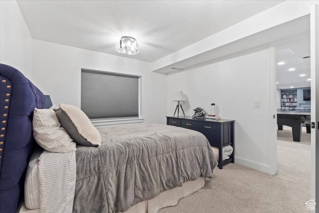 Bedroom with carpet and baseboards