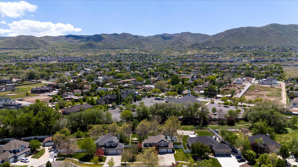 Aerial perspective of suburban area with a mountain backdrop
