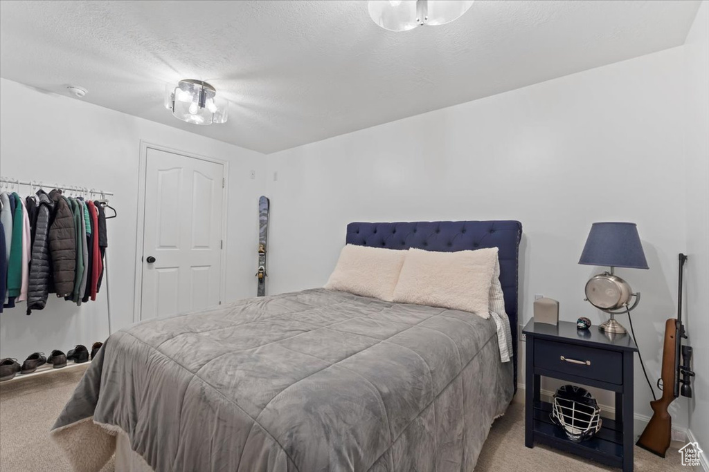 Carpeted bedroom with baseboards