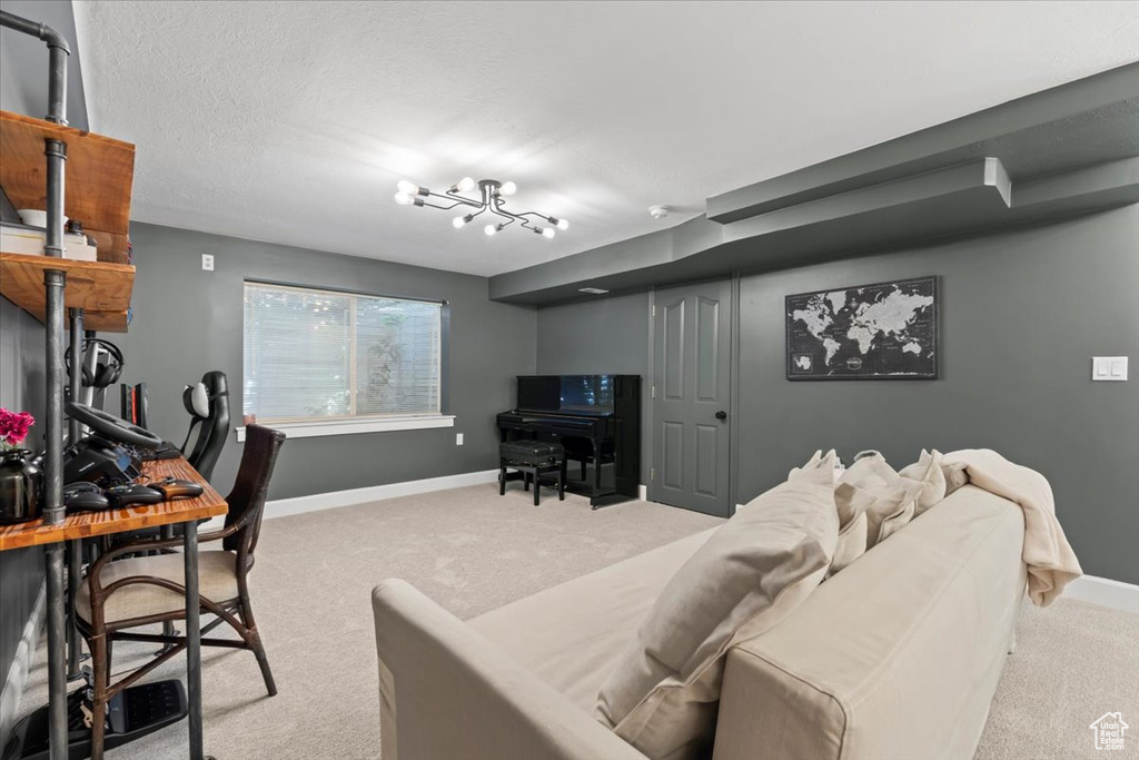 Living room featuring carpet flooring and baseboards